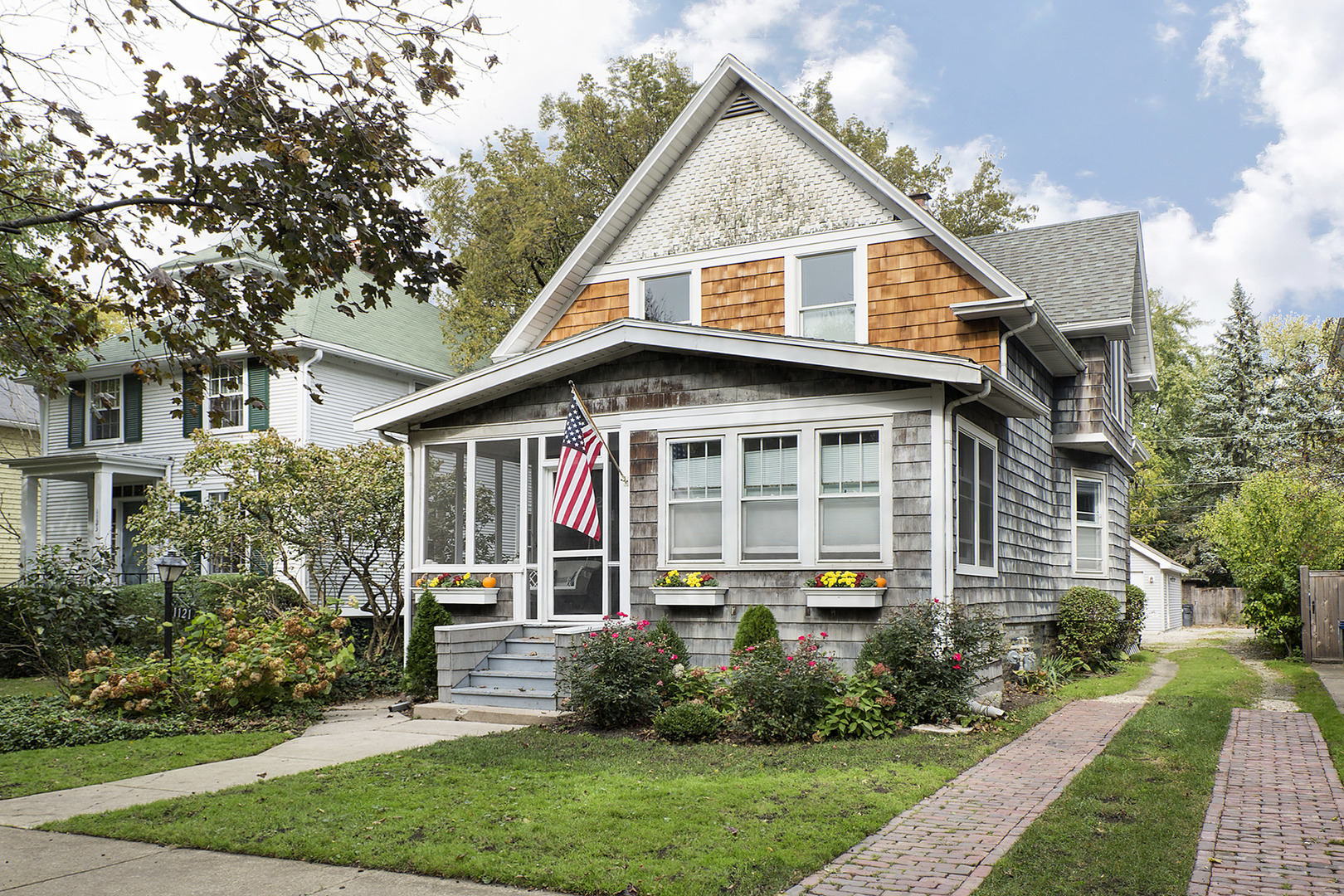 1121 Grant Street, Unit 2 Evanston, IL 60201 - Photo 1 of 8 a front view of a house with a yard