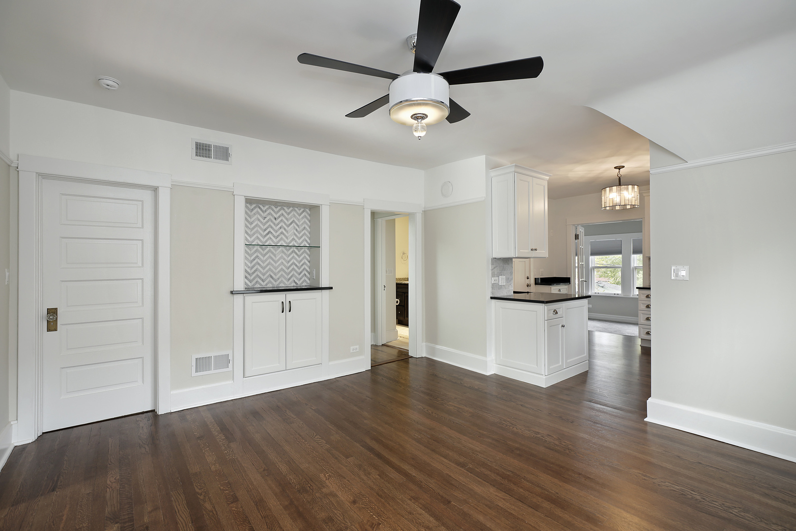 1121 Grant Street, Unit 2 Evanston, IL 60201 - Photo 2 of 8 a view of a kitchen with wooden floor and a window