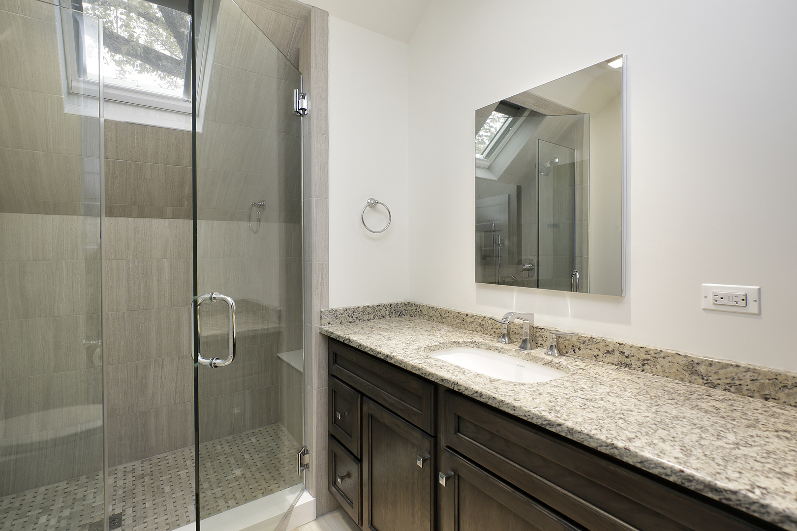 1121 Grant Street, Unit 2 Evanston, IL 60201 - Photo 7 of 8 a bathroom with a granite countertop sink and mirror