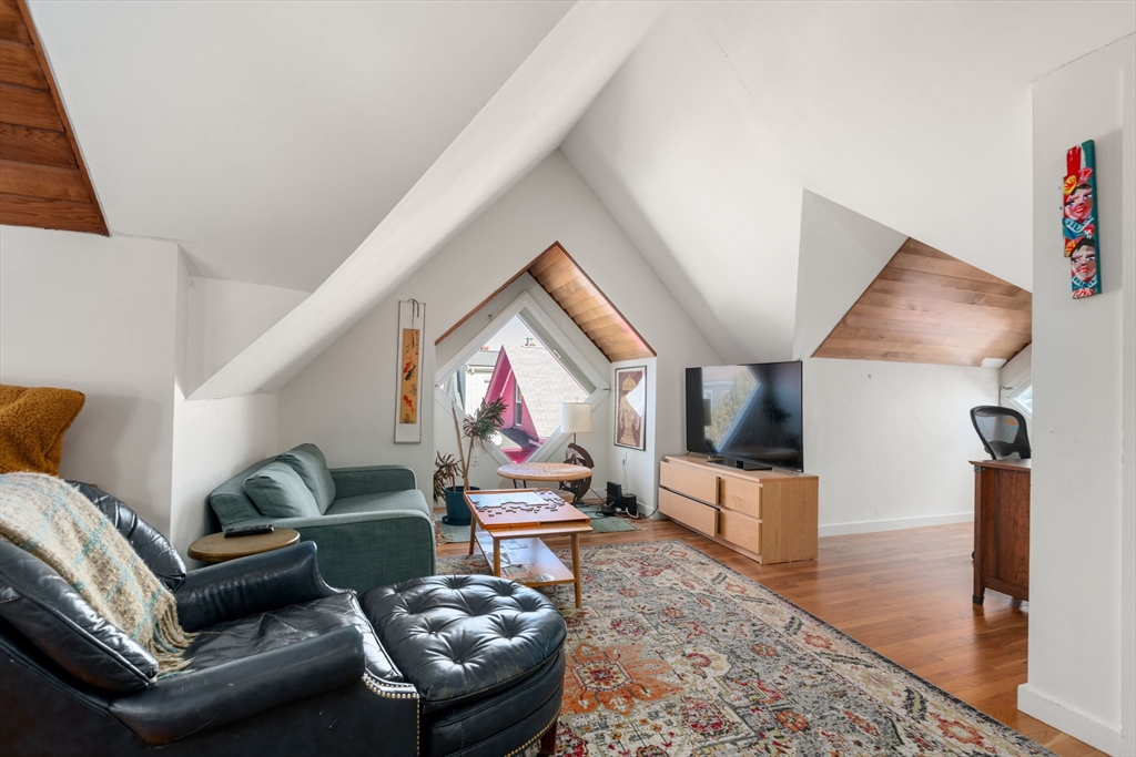 25 Perry Street, Unit 25 Somerville, MA 02143 - Photo 17 of 29 a living room with furniture and a flat screen tv