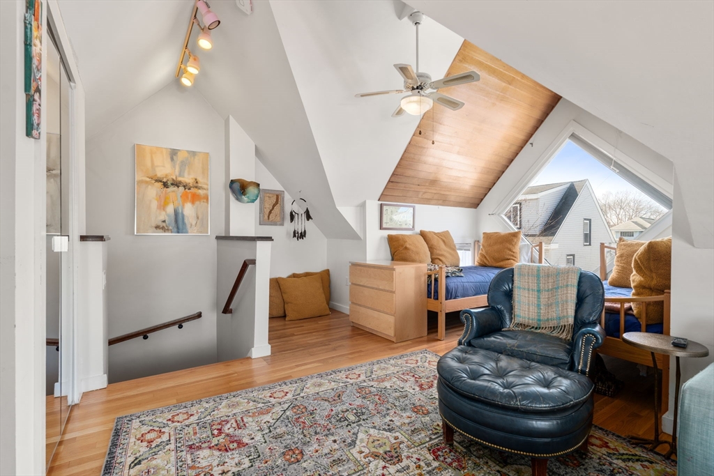 25 Perry Street, Unit 25 Somerville, MA 02143 - Photo 18 of 29 a living room with furniture and a fireplace
