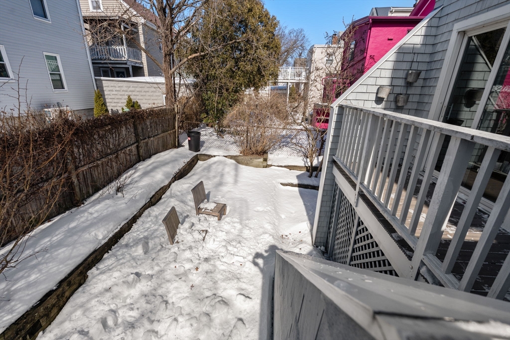 25 Perry Street, Unit 25 Somerville, MA 02143 - Photo 22 of 29 a view of balcony with wooden floor and fence