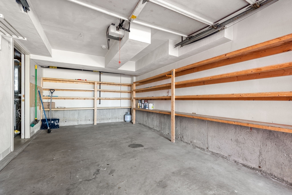 25 Perry Street, Unit 25 Somerville, MA 02143 - Photo 23 of 29 a view of an empty room with a staircase