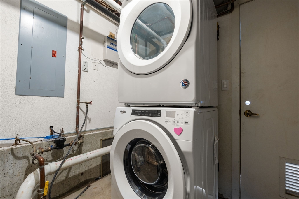 25 Perry Street, Unit 25 Somerville, MA 02143 - Photo 24 of 29 a view of a storage and utility room with washer and dryer