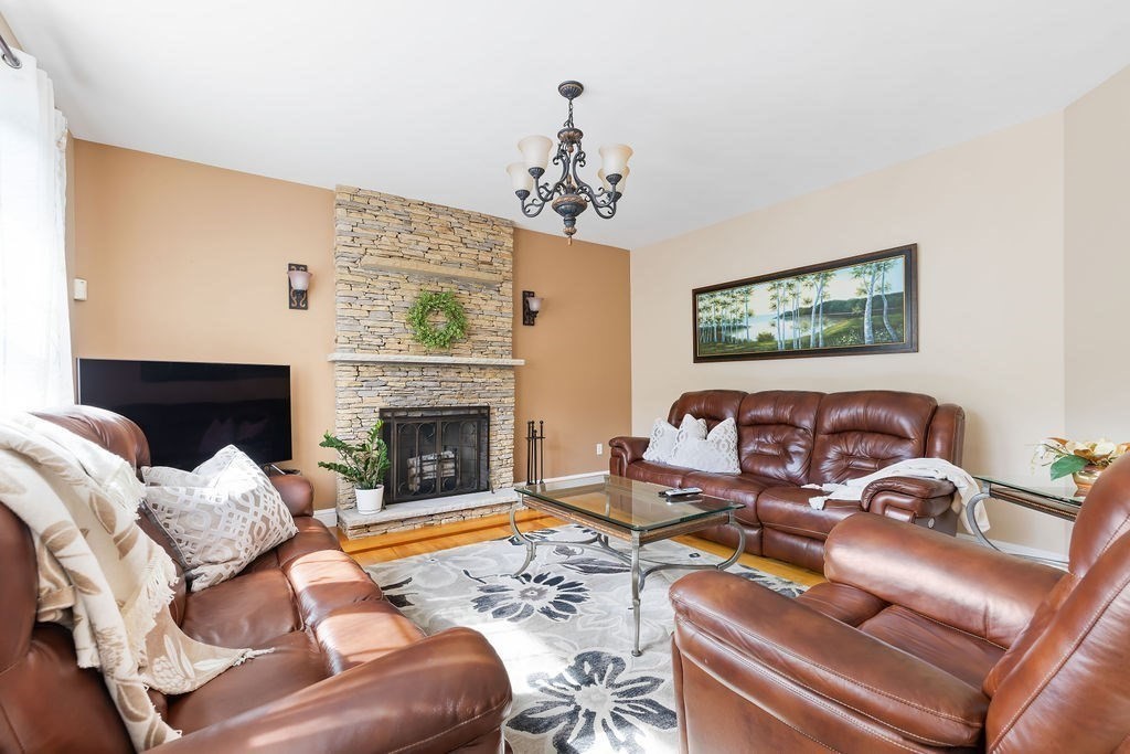 114 Upper Gore Road Webster, MA 01570 - Photo 13 of 40 a living room with furniture and a fireplace