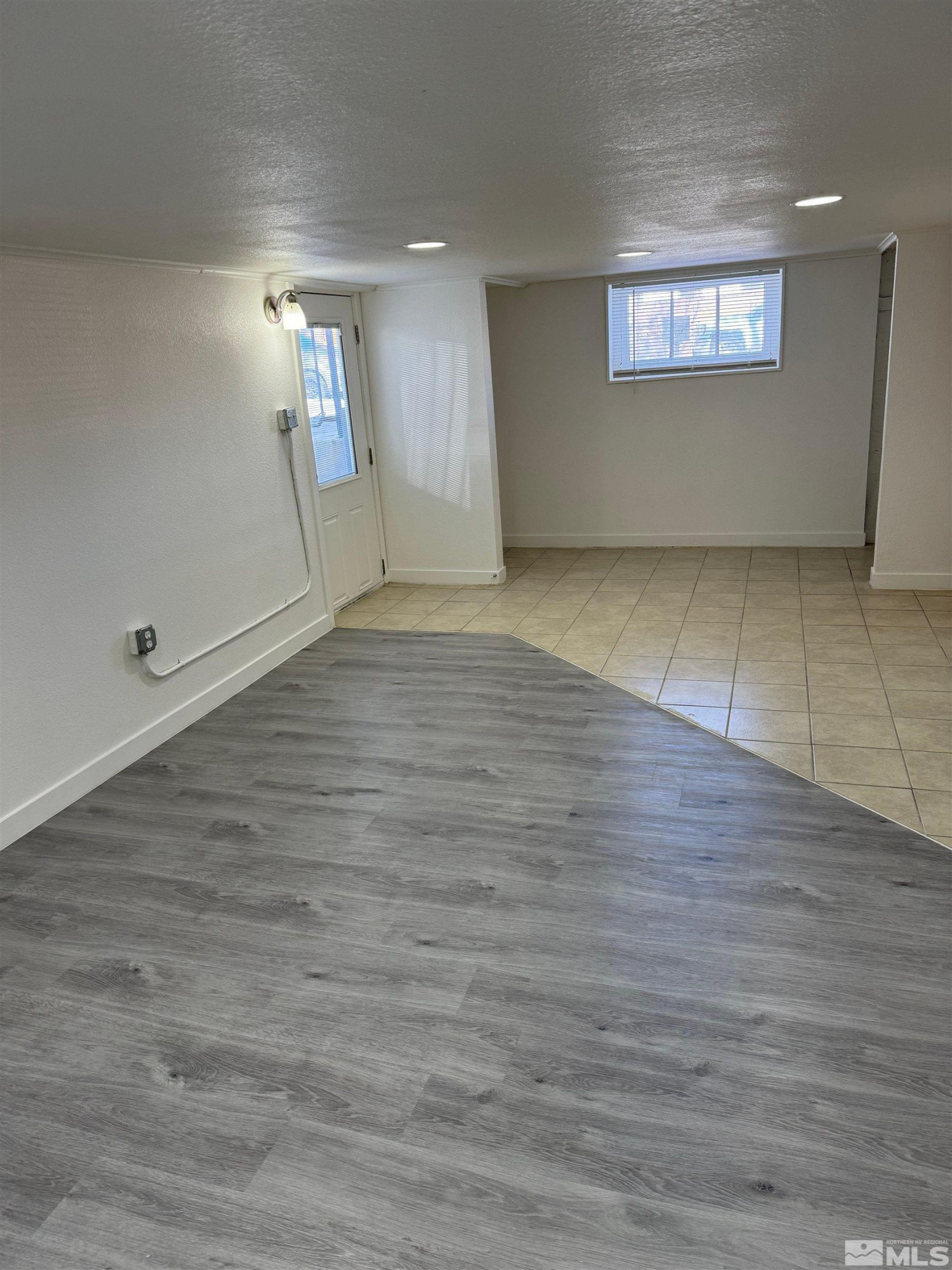 120 Martin Street Reno, NV 89509 - Photo 10 of 14 an empty room with wooden floor and windows