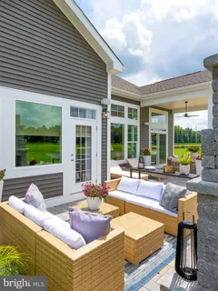a outdoor space with patio the couches and a potted plant