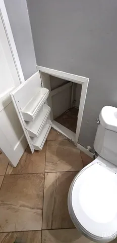 a view of a backyard with a garden and fire pit