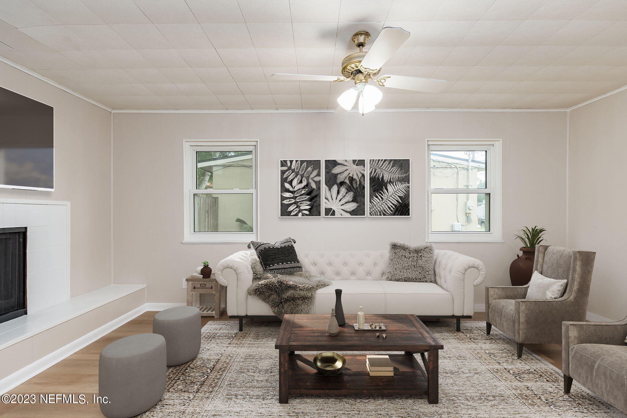6236 Suwanee Road Jacksonville, FL 32217 - Photo 12 of 38 a living room with furniture and a chandelier