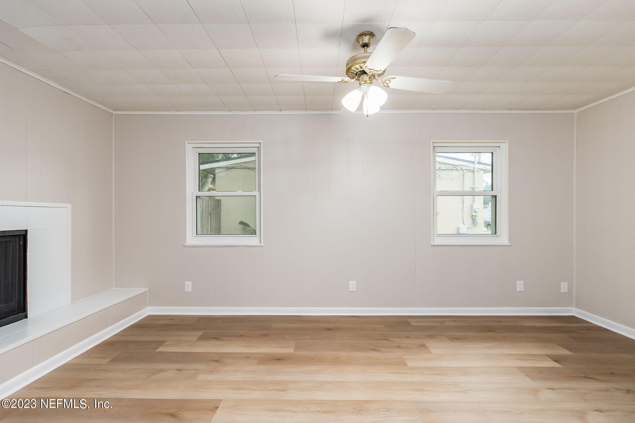 6236 Suwanee Road Jacksonville, FL 32217 - Photo 13 of 38 a view of a room with wooden floor and fan
