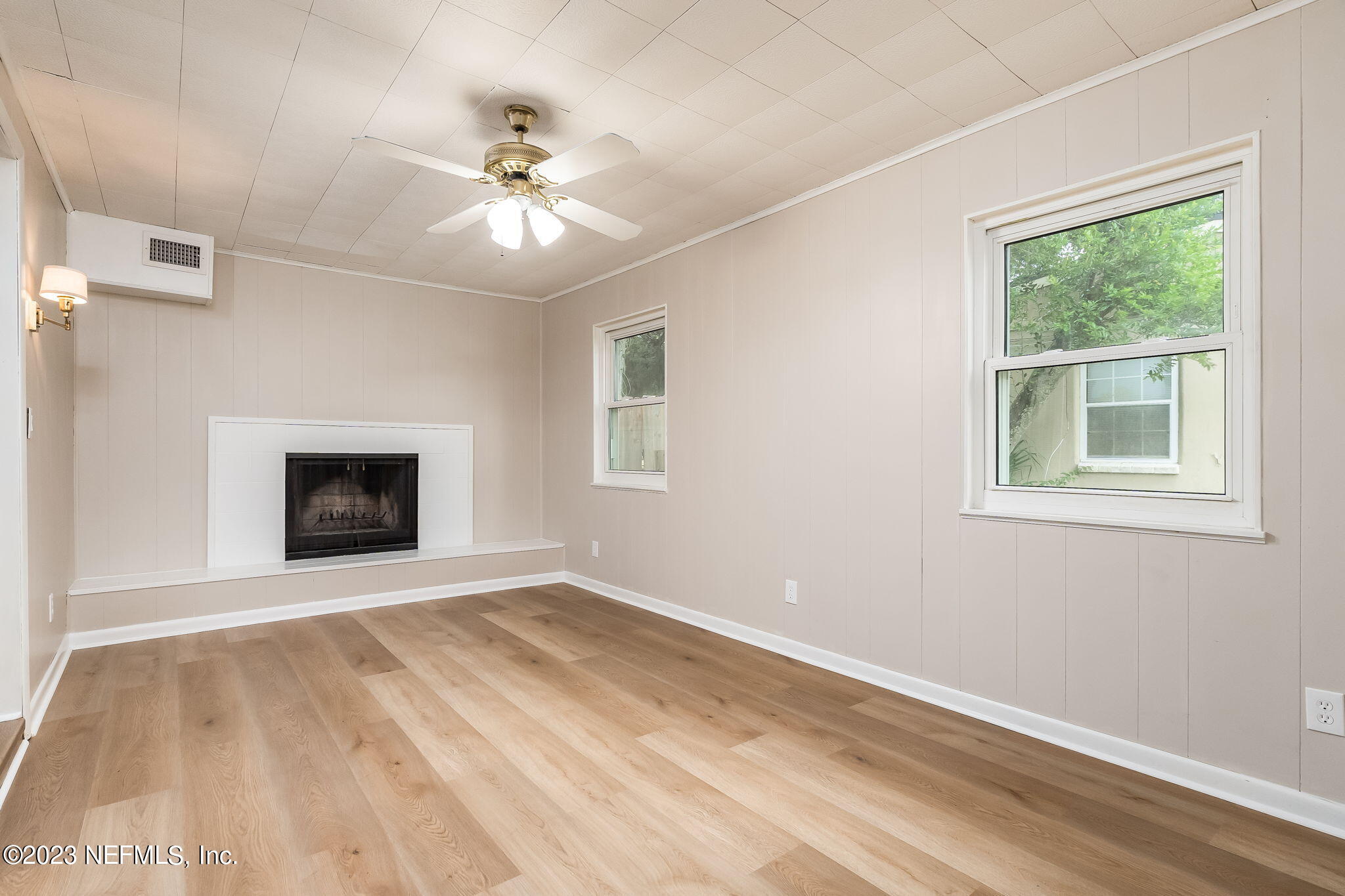 6236 Suwanee Road Jacksonville, FL 32217 - Photo 15 of 38 a view of an empty room with window and chandelier fan