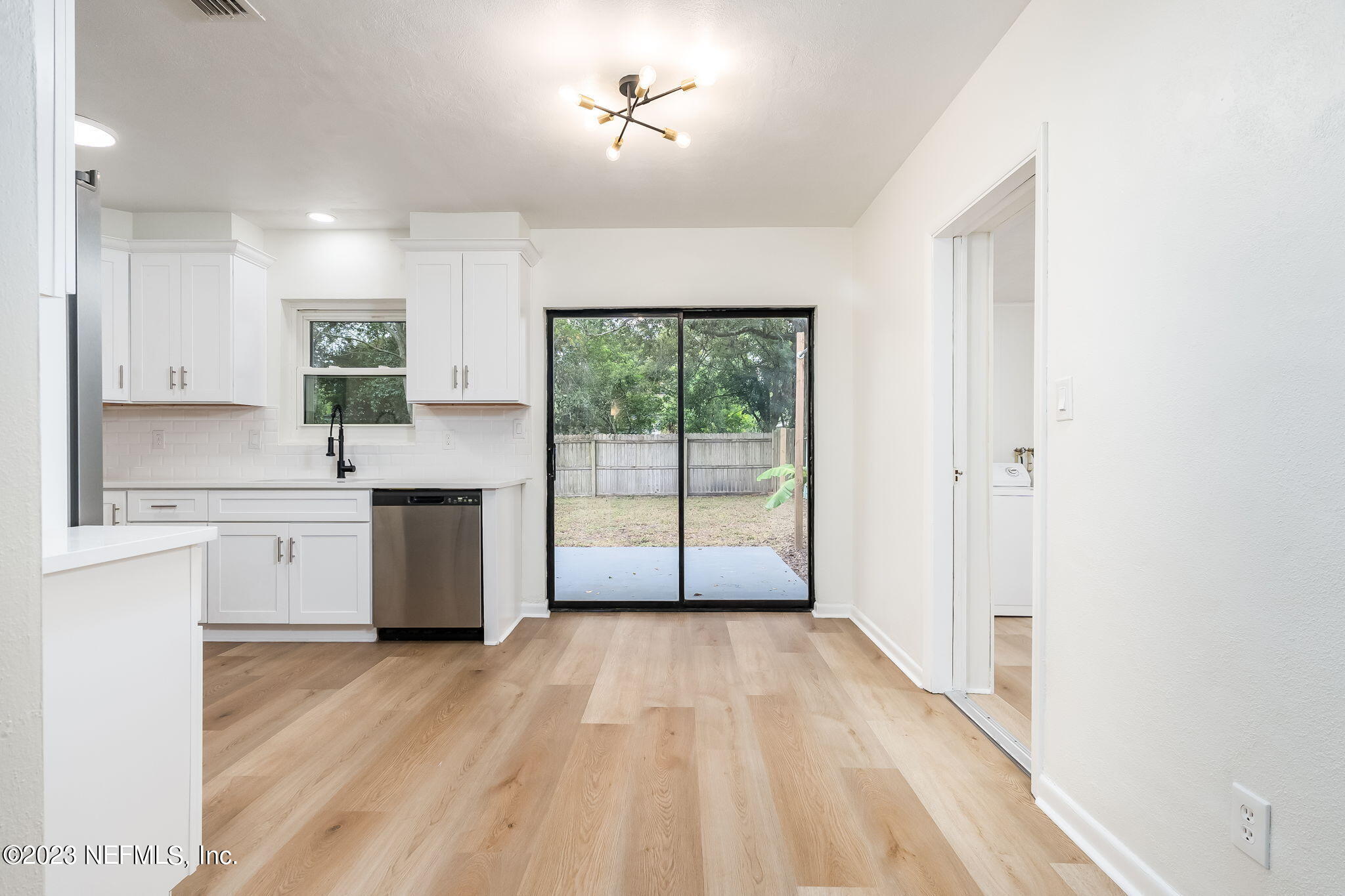 6236 Suwanee Road Jacksonville, FL 32217 - Photo 17 of 38 a view of a kitchen with a sink cabinets and a window
