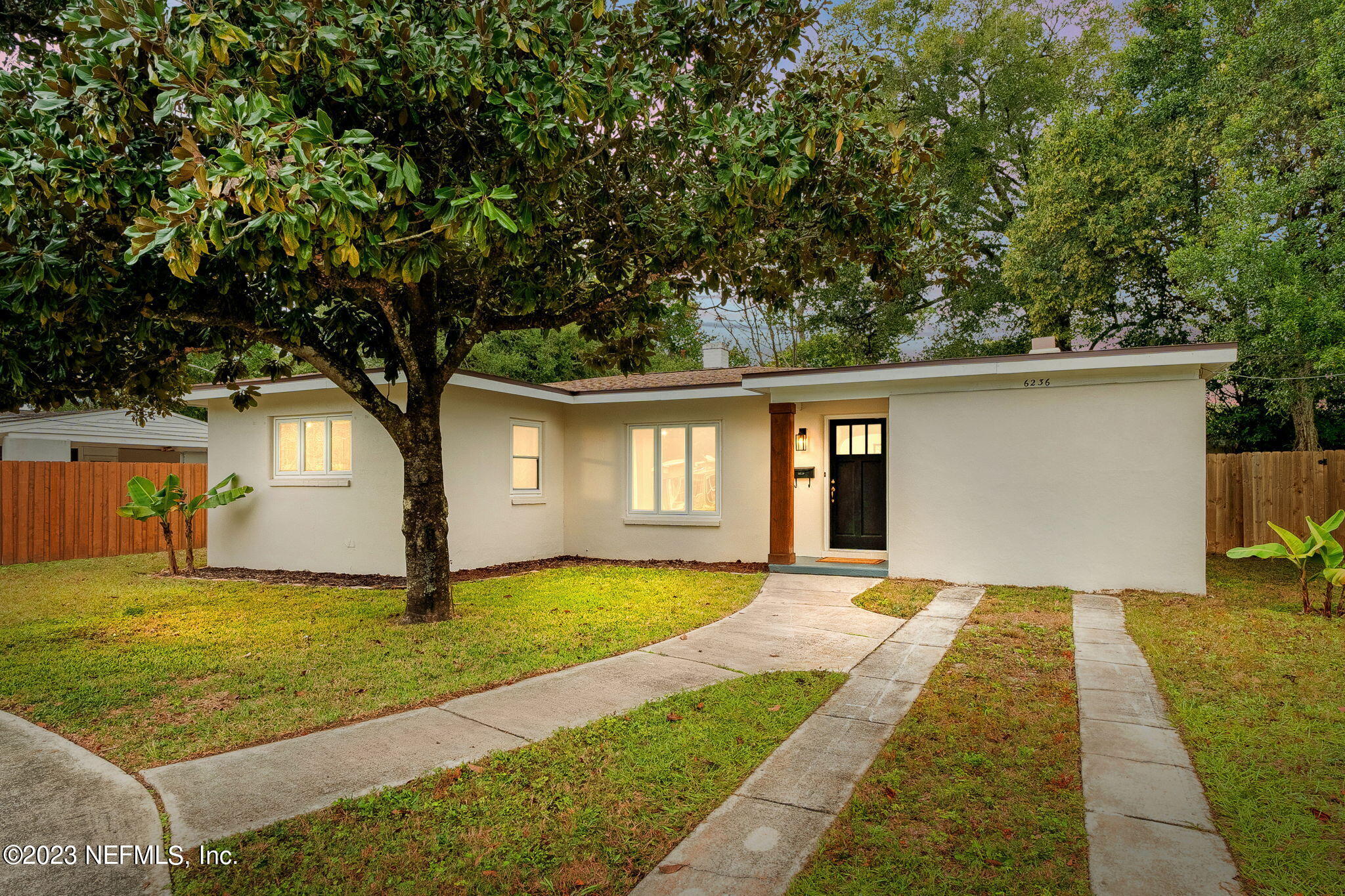 6236 Suwanee Road Jacksonville, FL 32217 - Photo 2 of 38 a front view of a house with a yard