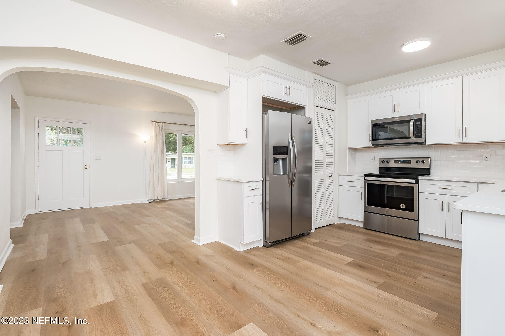 6236 Suwanee Road Jacksonville, FL 32217 - Photo 20 of 38 a kitchen with stainless steel appliances a refrigerator stove and microwave