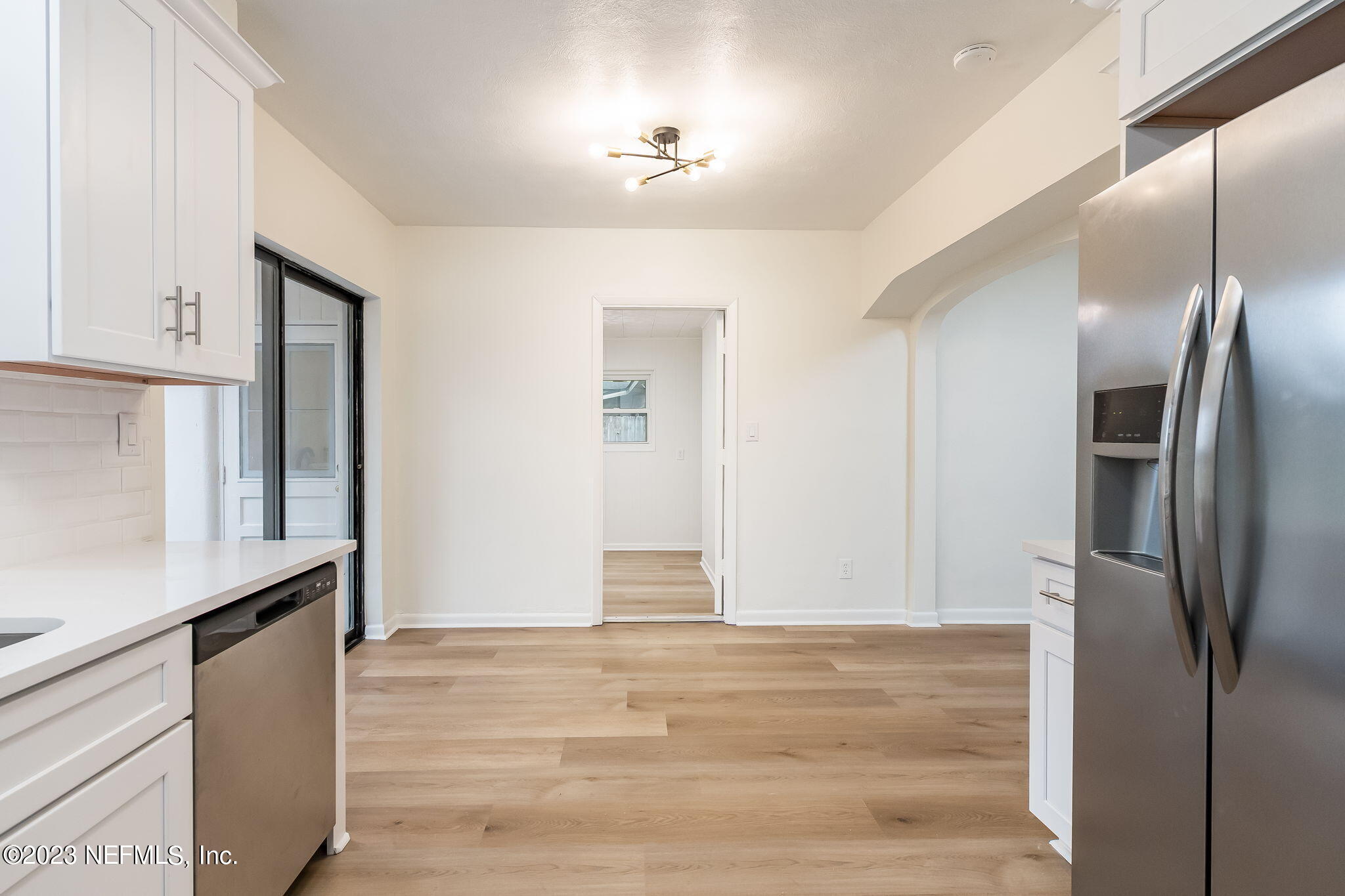 6236 Suwanee Road Jacksonville, FL 32217 - Photo 21 of 38 a view of a kitchen with wooden floor and a kitchen space