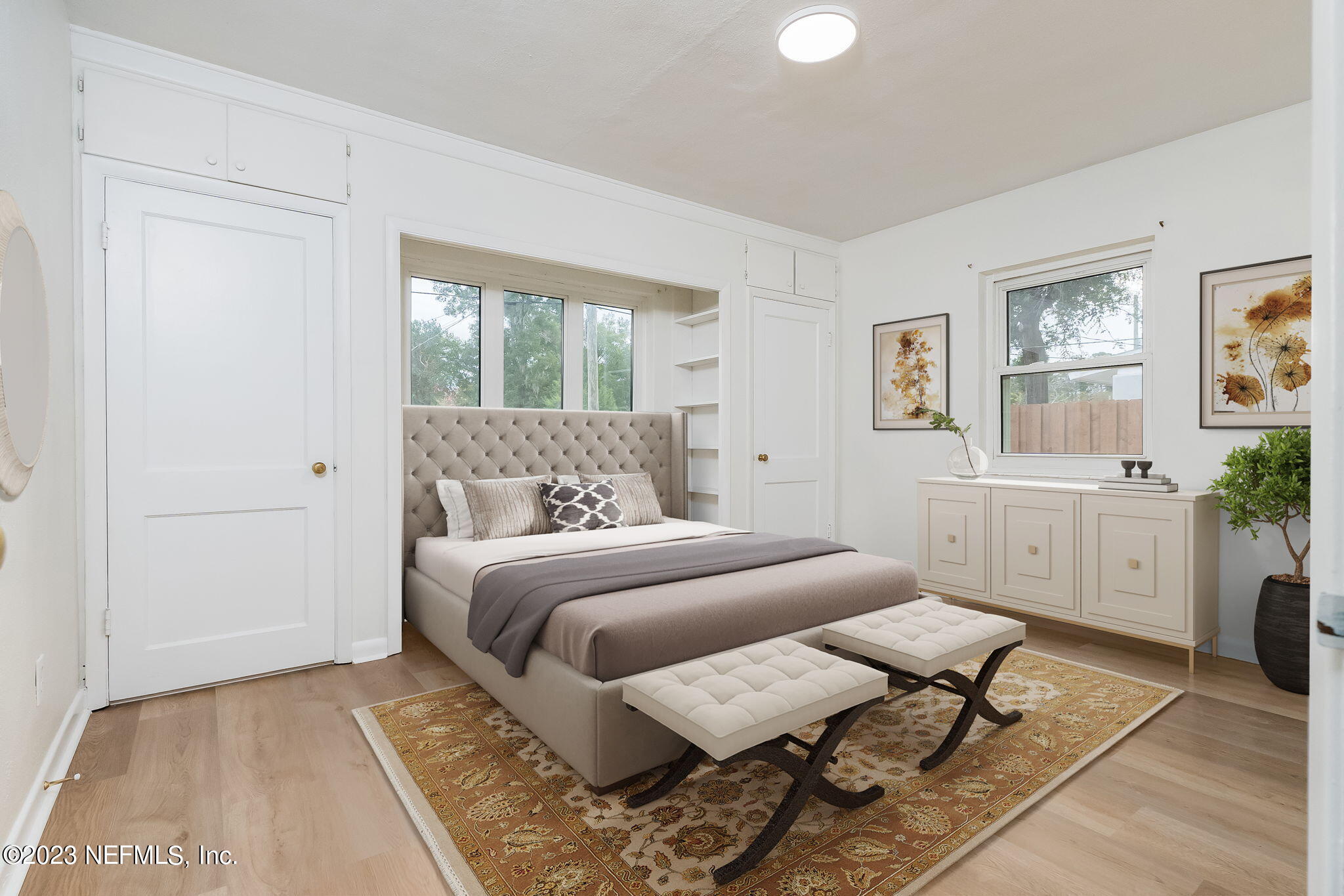 6236 Suwanee Road Jacksonville, FL 32217 - Photo 23 of 38 a bedroom with a large bed and a window