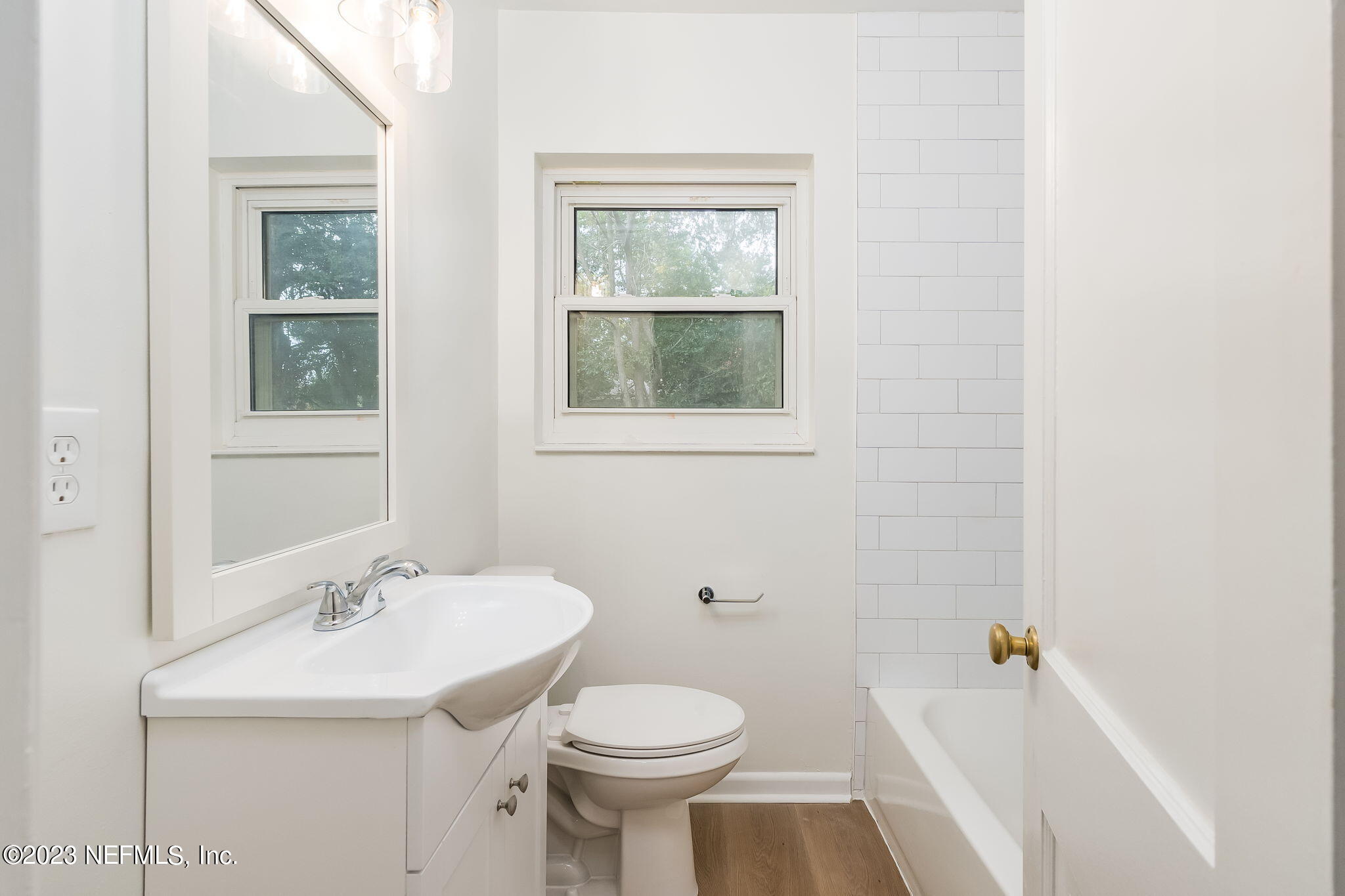 6236 Suwanee Road Jacksonville, FL 32217 - Photo 27 of 38 a bathroom with a sink toilet and a window