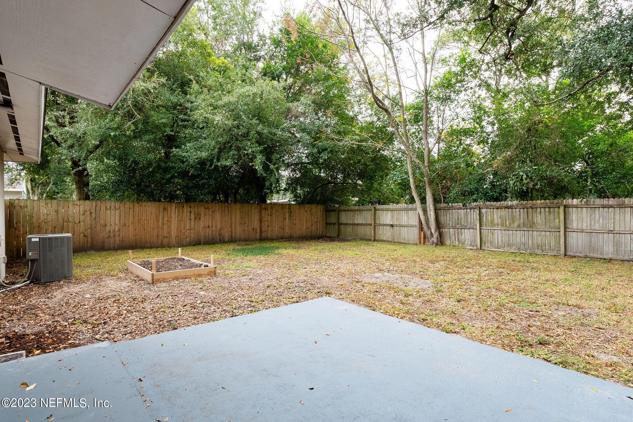 6236 Suwanee Road Jacksonville, FL 32217 - Photo 29 of 38 a backyard of a house with a trees