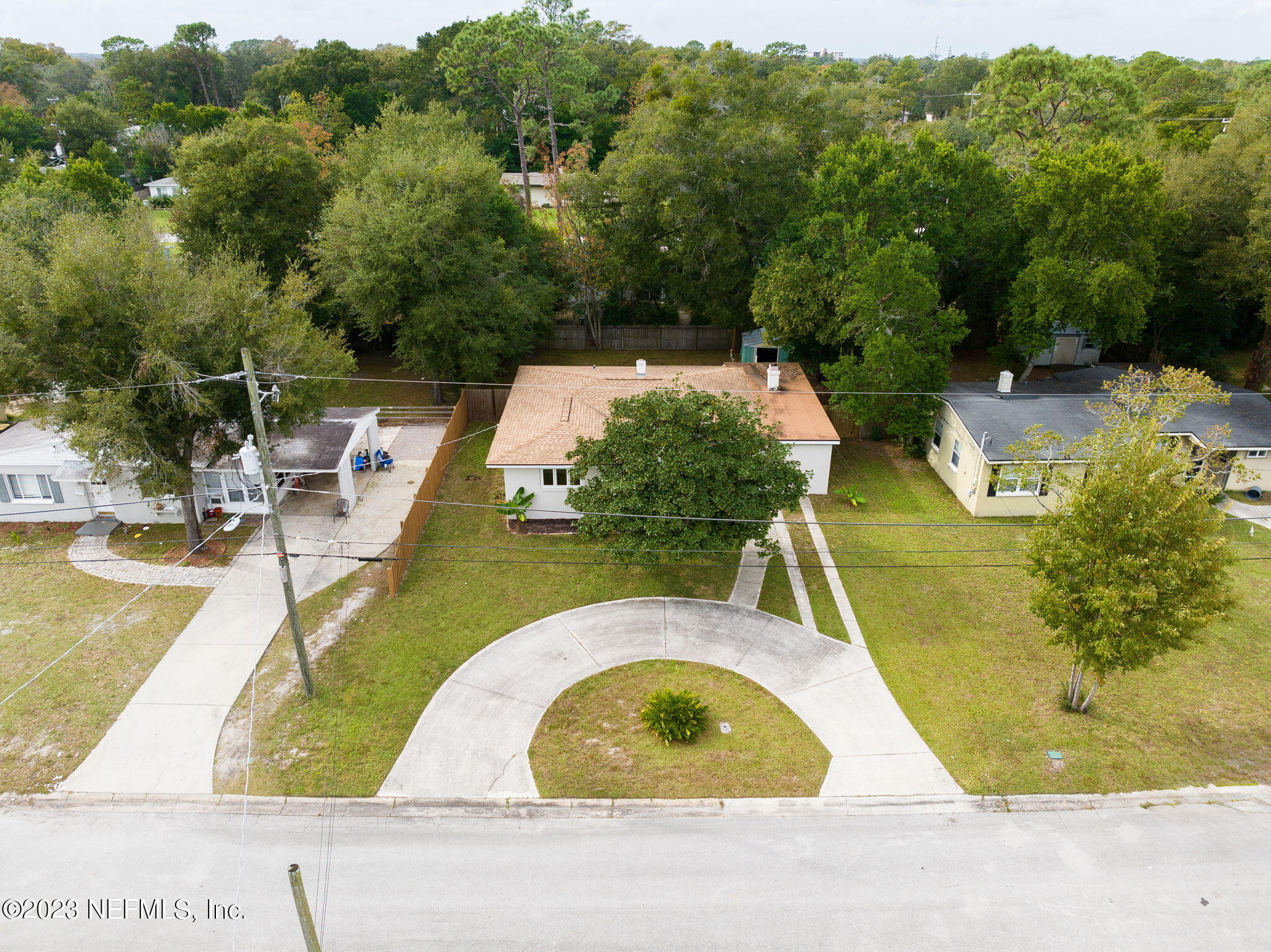 6236 Suwanee Road Jacksonville, FL 32217 - Photo 33 of 38 a view of a swimming pool with a yard