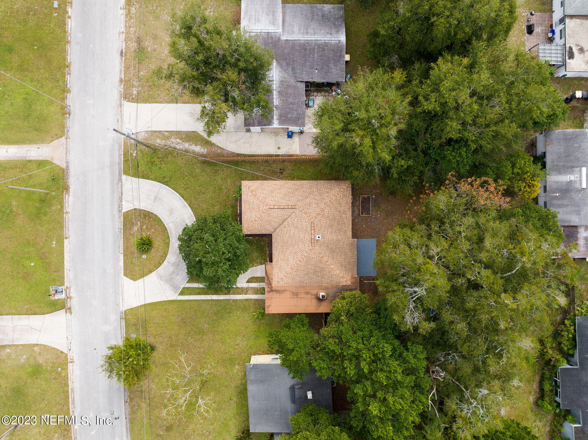 6236 Suwanee Road Jacksonville, FL 32217 - Photo 36 of 38 an aerial view of a house with outdoor swimming pool and tennis court