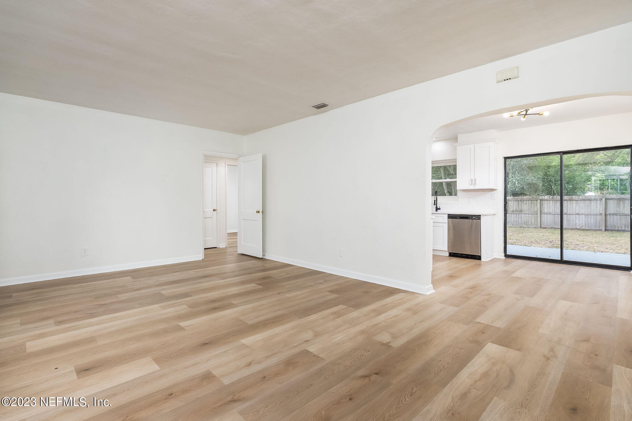 6236 Suwanee Road Jacksonville, FL 32217 - Photo 9 of 38 an empty room with large windows