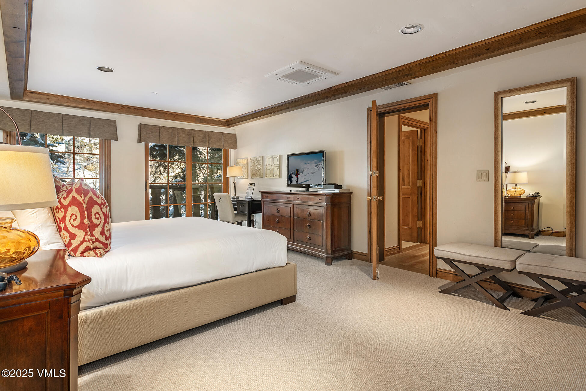 352 East Meadow Drive, Unit J Vail, CO 81657 - Photo 14 of 47 a bed room with a bed and a chair