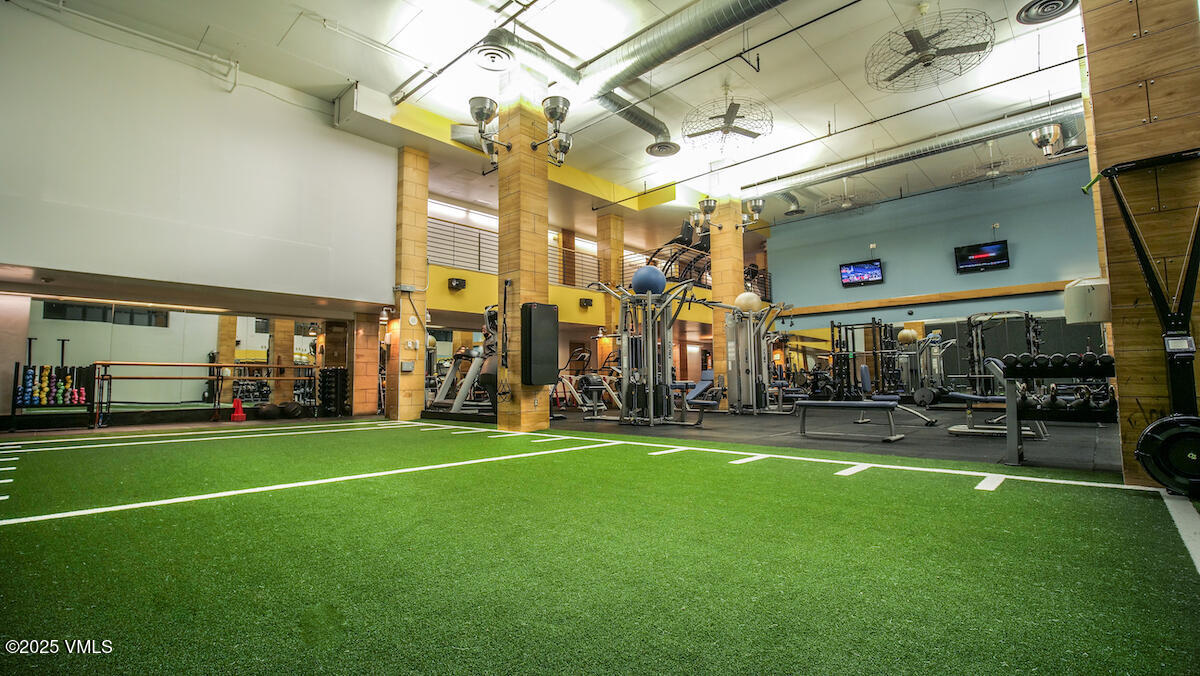 352 East Meadow Drive, Unit J Vail, CO 81657 - Photo 22 of 47 a view of a building with a yard