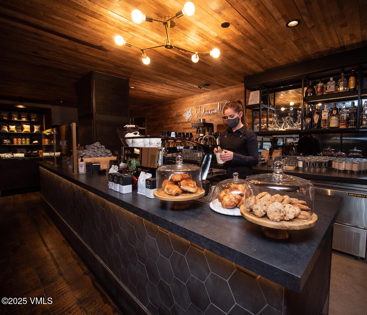 352 East Meadow Drive, Unit J Vail, CO 81657 - Photo 32 of 47 a kitchen with a table and chairs