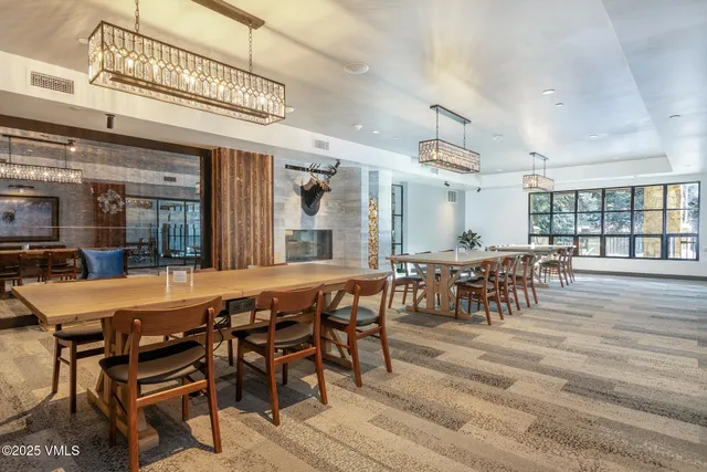 a living room filled with furniture and a table