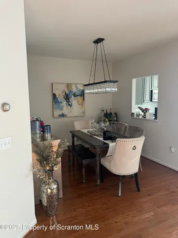 a living room with furniture a rug and a chandelier
