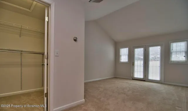 a view of an empty room and window
