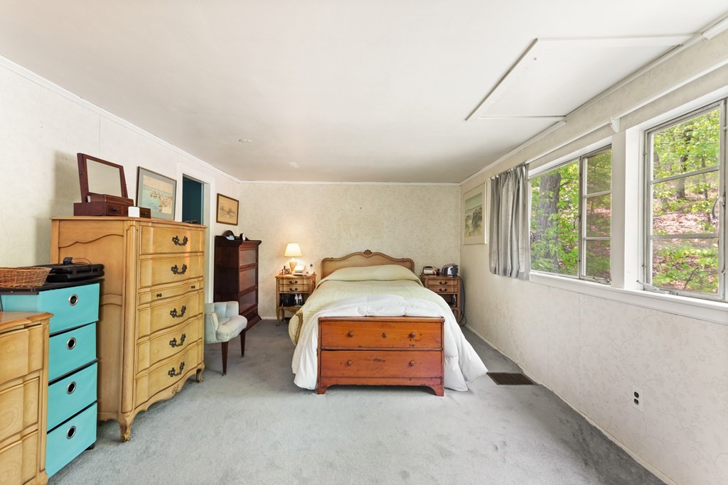73 Old County Road Lincoln, MA 01773 - Photo 12 of 15 a spacious bedroom with a bed and a tv