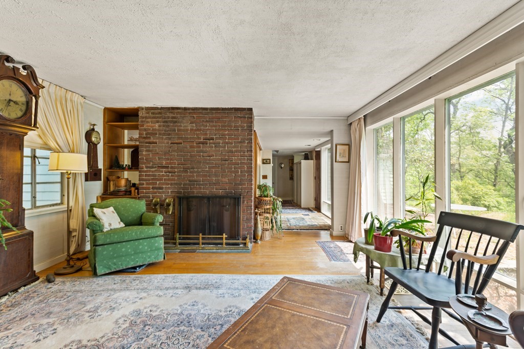 73 Old County Road Lincoln, MA 01773 - Photo 3 of 15 a living room with furniture and a fireplace