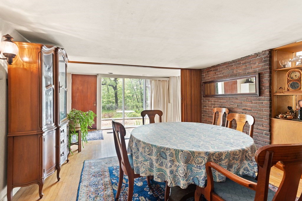 73 Old County Road Lincoln, MA 01773 - Photo 4 of 15 a view of a dining room with furniture window and wooden floor