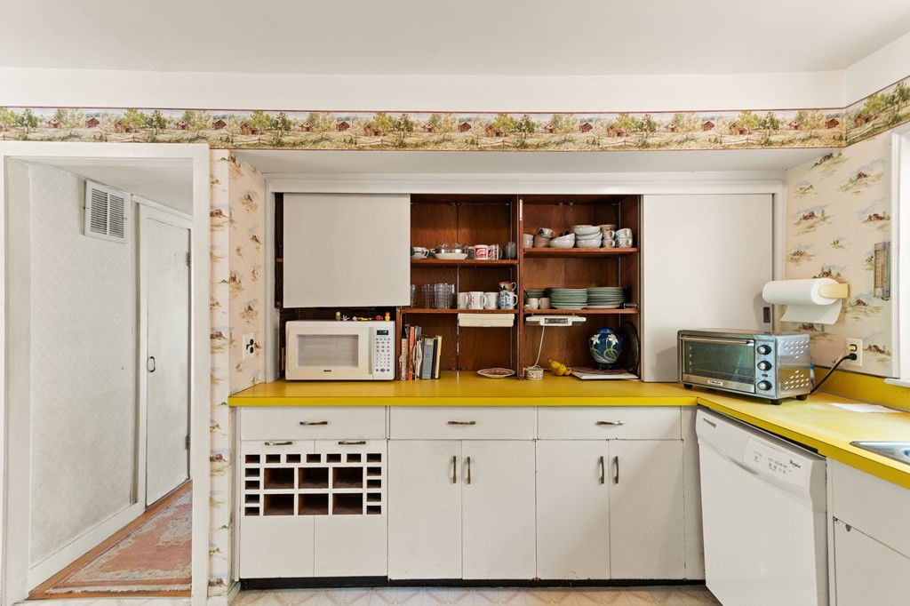 73 Old County Road Lincoln, MA 01773 - Photo 6 of 15 a kitchen with a refrigerator and a stove