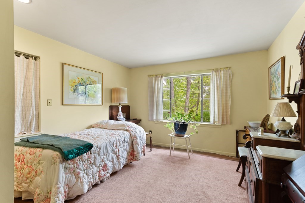 73 Old County Road Lincoln, MA 01773 - Photo 8 of 15 a bedroom with a bed chair and a window