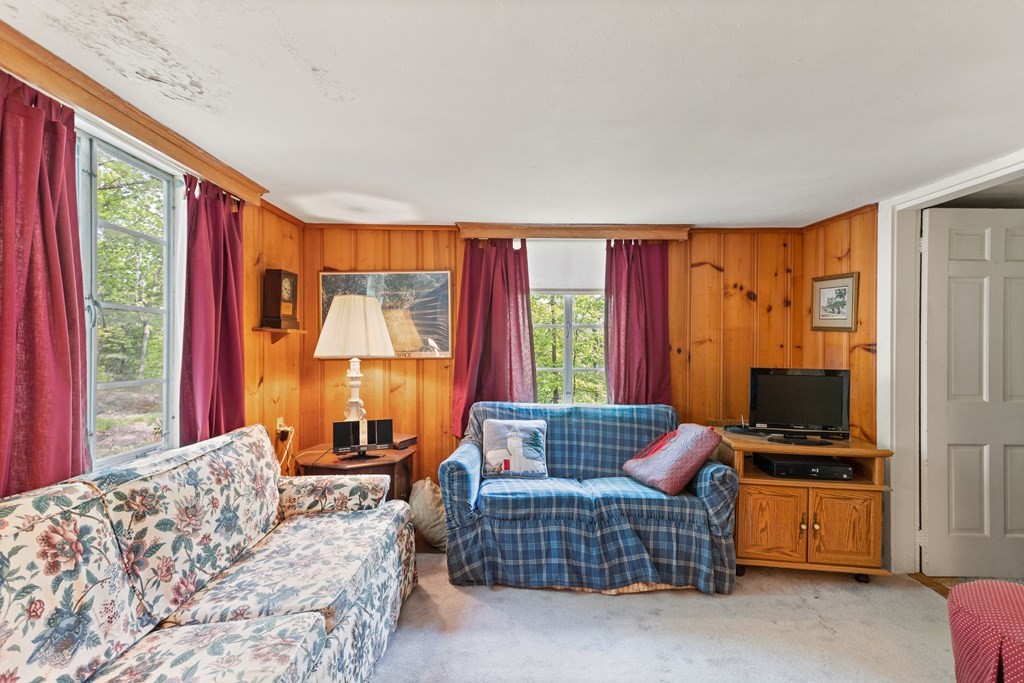 73 Old County Road Lincoln, MA 01773 - Photo 9 of 15 a living room with furniture a flat screen tv and a window