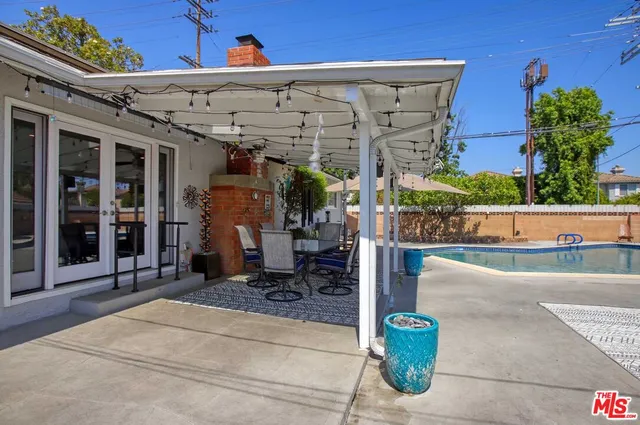 a view of a chairs and table in the patio
