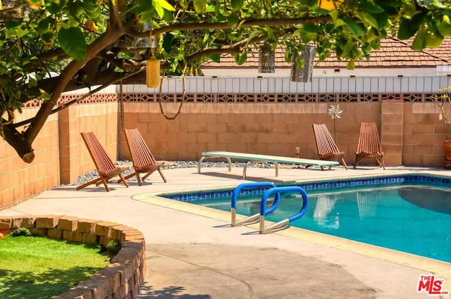 a view of a room with a table and chairs