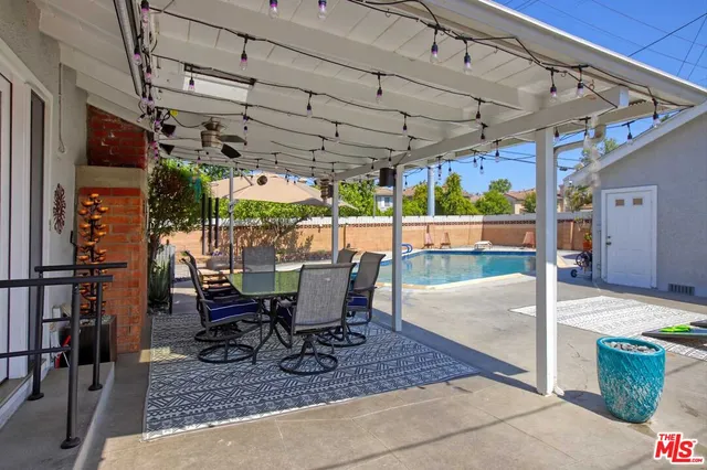 a view of a swimming pool with a patio