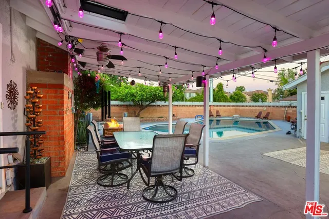 a view of a chairs and table in patio