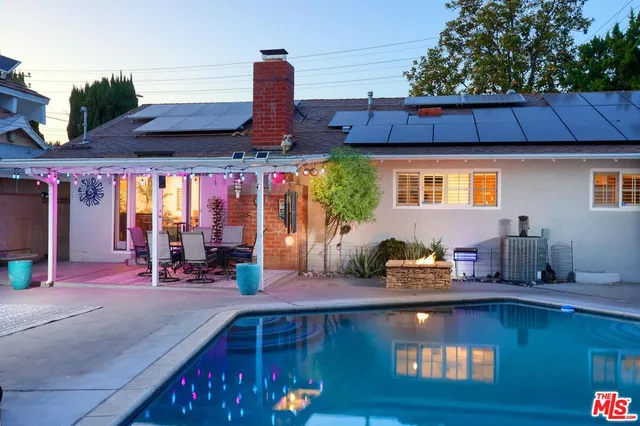 a front view of a building with outdoor seating