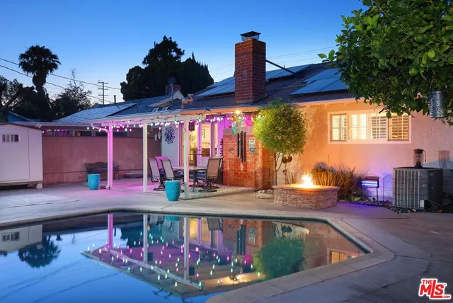 a view of a swimming pool with a patio