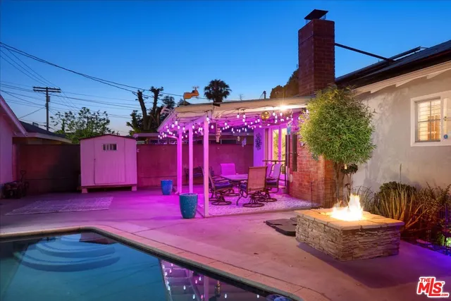 a view of a swimming pool with a patio