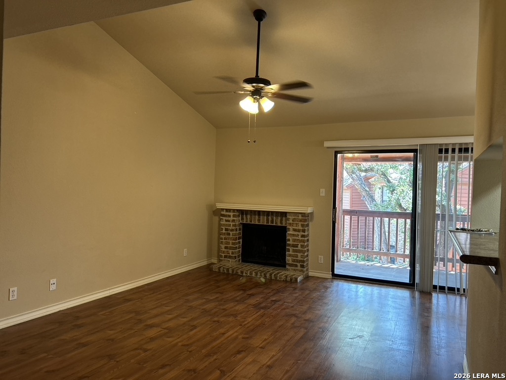 13018 Heimer Road, Unit 710 San Antonio, TX 78216 - Photo 5 of 27 a view of a livingroom with wooden floor a ceiling fan and windows
