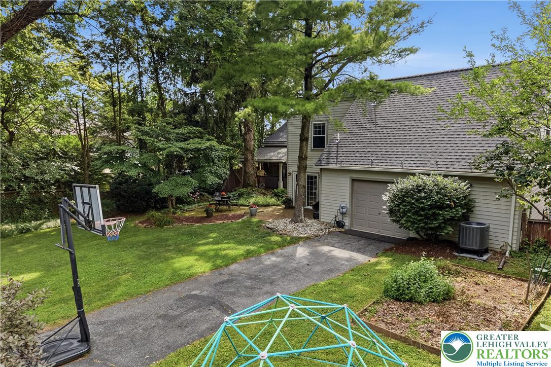 2014 Linden Street Bethlehem, PA 18017 - Photo 72 of 85 A verdant backyard retreat featuring a basketball hoop, established trees, and ample green space.