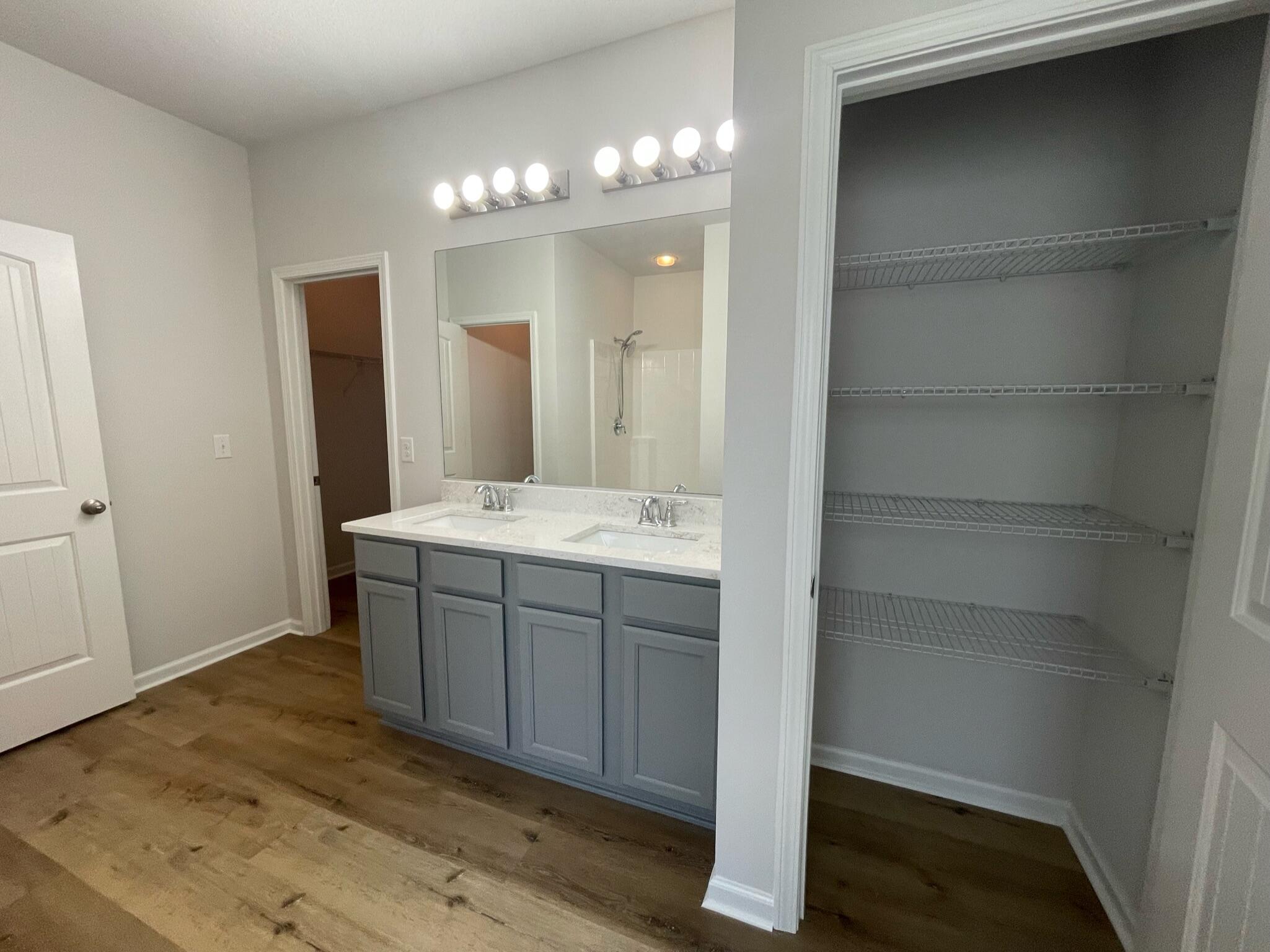 56 Lilly Bell Lane Freeport, FL 32439 - Photo 11 of 20 a bathroom with a sink and a mirror
