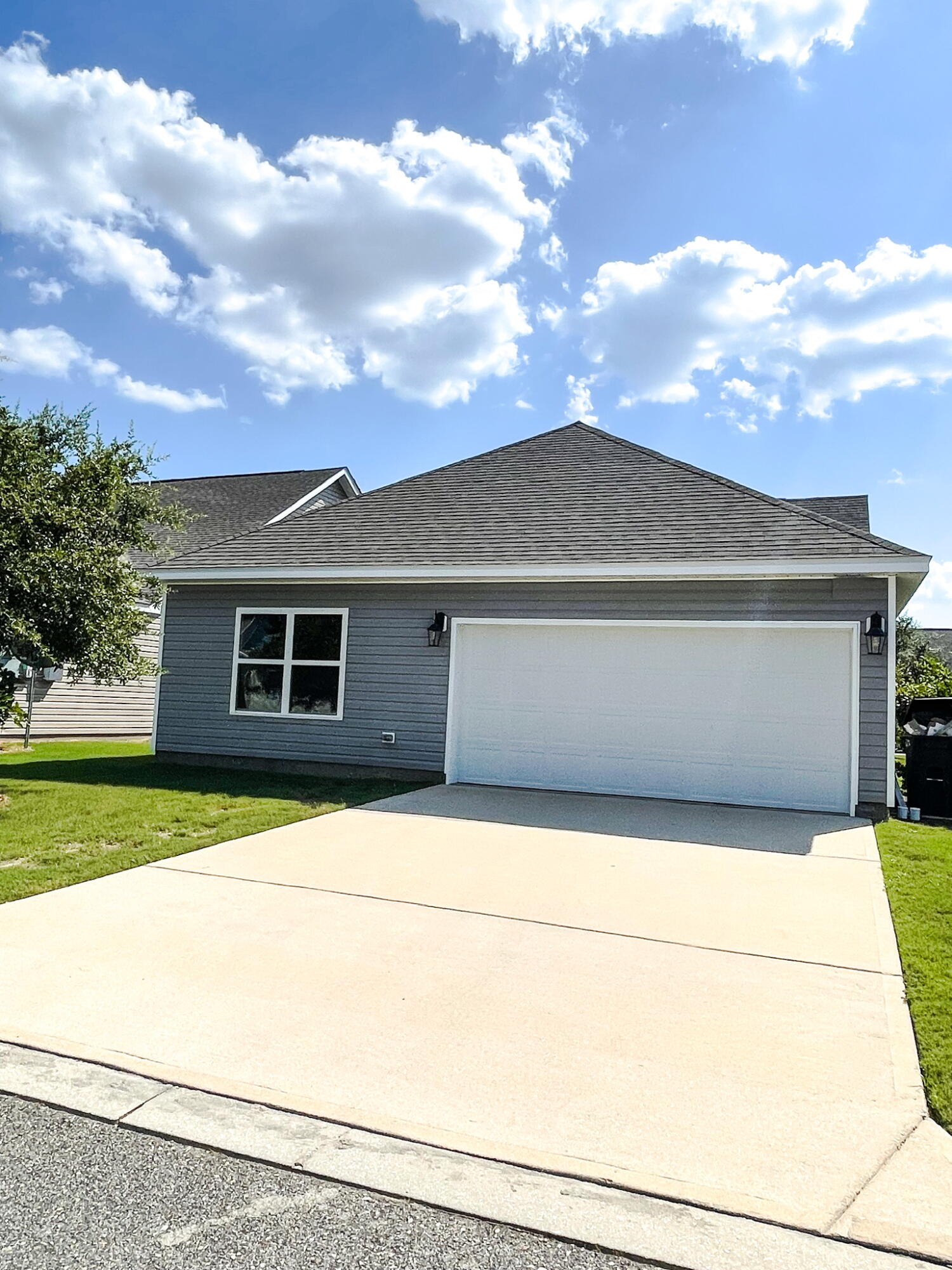 56 Lilly Bell Lane Freeport, FL 32439 - Photo 13 of 20 a front view of a house with a yard