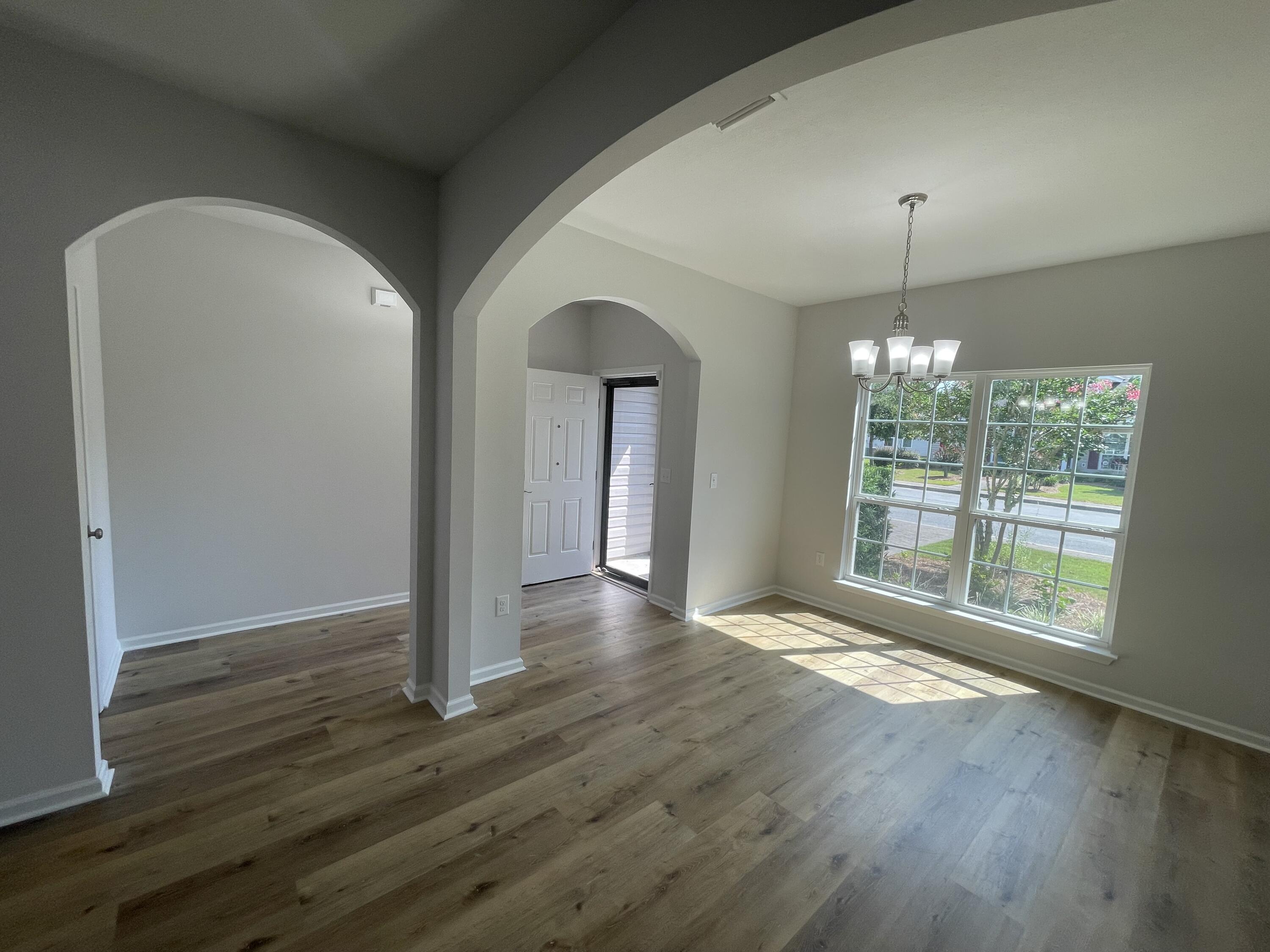 56 Lilly Bell Lane Freeport, FL 32439 - Photo 20 of 20 a view of an empty room with window and wooden floor