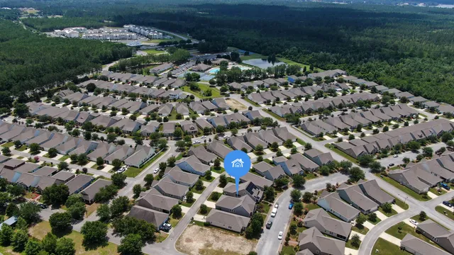 a kitchen with stainless steel appliances kitchen island granite countertop a refrigerator a sink a stove a microwave and island